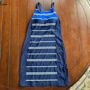 Athlete Dress.  Navy, white, blue.  Never worn.  Breast pads.  Size Small.